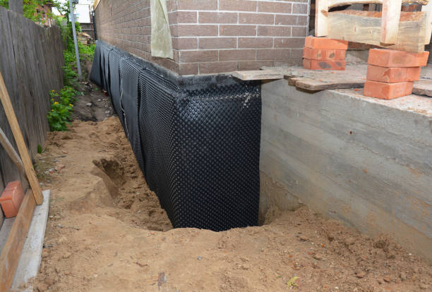 Happy homeowners after waterproofing job in Muskego